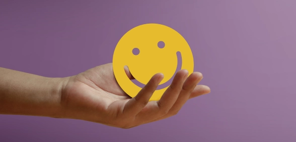 Holding a happy face